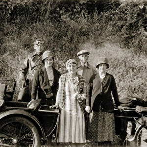 Ladies & gentledmen with their 1928 Royal Enfield motorcycle