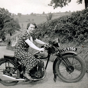 Lady on a 1929 Royal Enfield motorcycle