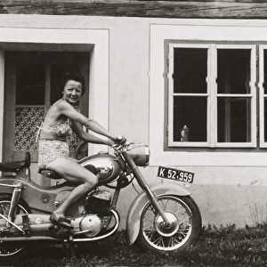 Lady on a 1958 / 9 Puch motorcycle