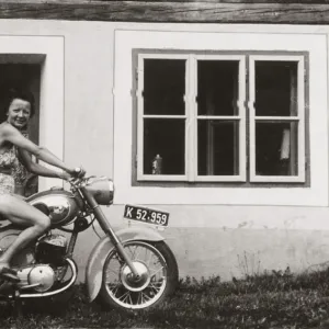 Lady on a 1958 / 9 Puch motorcycle