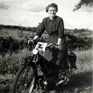 Lady learner on a 1930s / 40s Velocette motorcycle