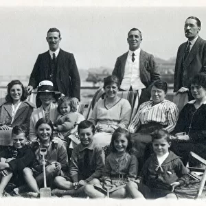 Large extended family group on a British beach