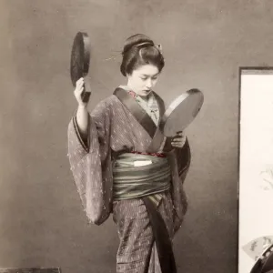 Late 19th century - young Japanese woman with mirrors