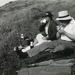 A late middle-aged couple enjoying a picnic