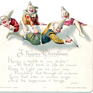 Four laughing clowns on a Christmas card