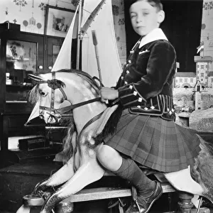 Little boy on rocking horse