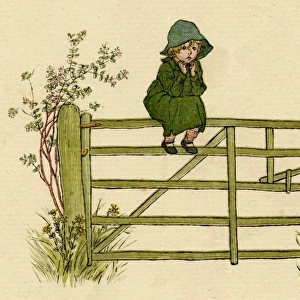 Little child sitting on a fence