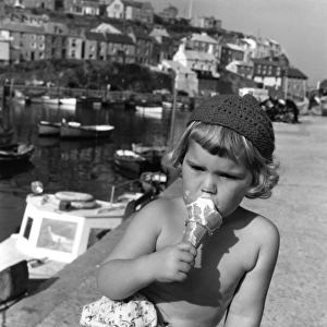 Little girl eating an ice cream, Cornwall