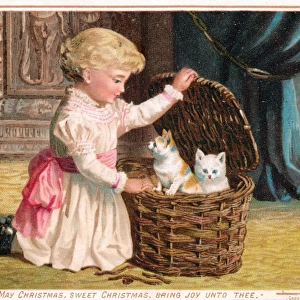 Little girl with two kittens on a Christmas card