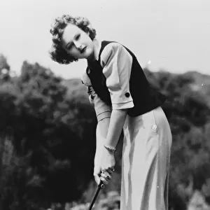Lynne Carver in a golf outfit designed by Dolly Tree in 1940
