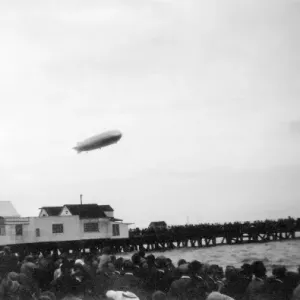 LZ 127 Graf Zeppelin over pier, Walton, Essex