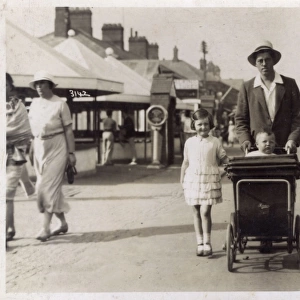 Mablethorpe, Lincolnshire - Gent pushing his young baby