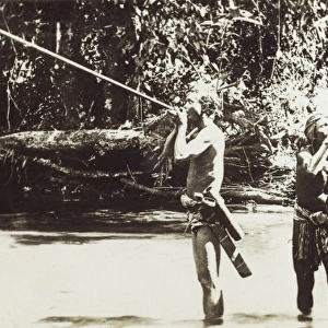Malaysia - Men from the Sohail Tribe using blow pipes
