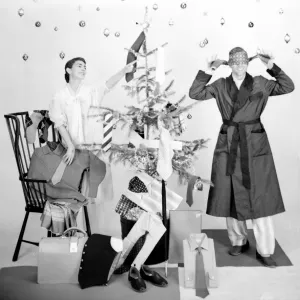 Male and female models in Christmas morning scene Male and female models in Christmas morning scene