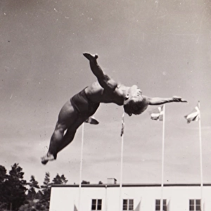 Male gymnast backward leap