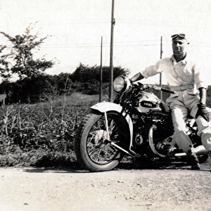 Man on his 1937 Ariel Square Four motorcycle