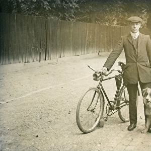 Man with bicycle and dog