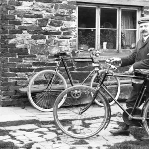 Man with bicycles outside house