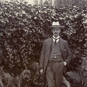 Man with a bulldog in a garden