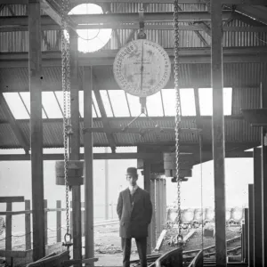 Man under coal weighing machine, Llanerch Colliery