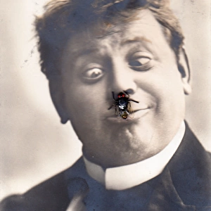 Man with an insect on his nose on a novelty postcard