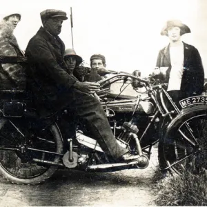 Man sitting on a 1921 / 22 Blackburne motorcycle & sidecar