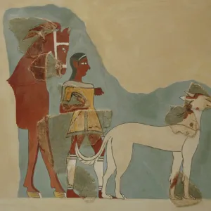 Man standing holding the reins of a horse with a dog before