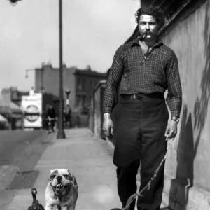 Man taking monkey, dog and duck for a walk