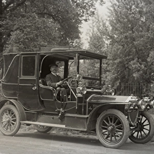 Man at the wheel of a car