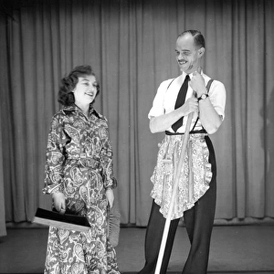 Man and woman performing a comic sketch