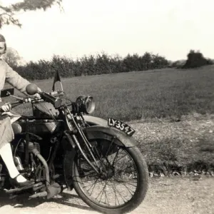 Man & woman on veteran motorcycle combination