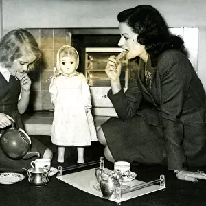 Margaret Lockwood at tea party with daughter Julia