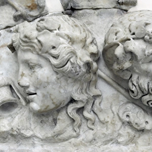 Masks of Dionysos and Silenos. Roman relief. 2nd century AD