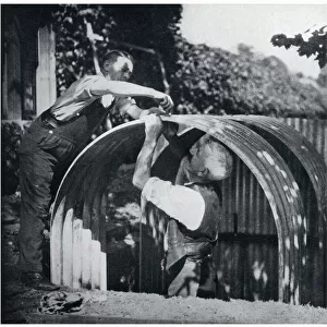 Two men building an Anderson shelter, September 1939