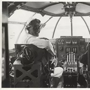 Two men at the controls of a Sunderland flying boat