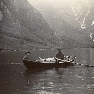 Two men with pigs on the Esserfjord, Norway