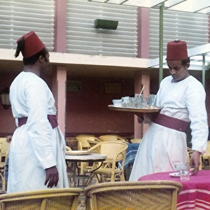 Two men in traditional Egyptian waiter?s dress in a restaura