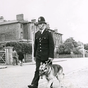 Metropolitan Police officer and his Alsatian dog