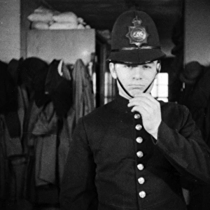 Metropolitan Police officer fitted with his uniform