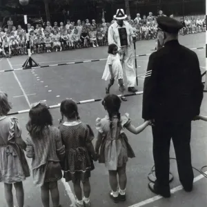 1949 Print: Metropolitan Police officers teaching road safety to children 1949 Print: Metropolitan Police officers teaching road safety to children