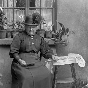 Middle-aged woman with potted plants