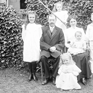 Middle class family group in a garden, Mid Wales