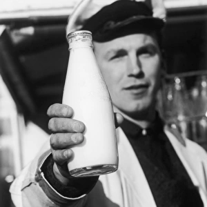 Milkman Holds Bottle