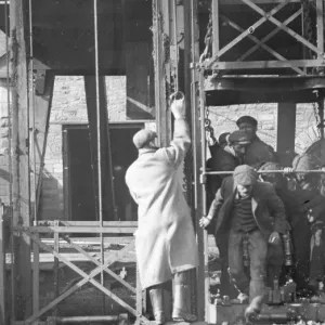 Miners getting out of a shaft lift, South Wales