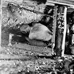 Two miners in a narrow coal seam, South Wales