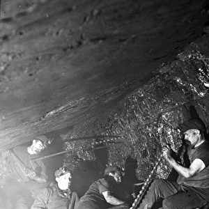 Miners in a narrow coal seam, South Wales