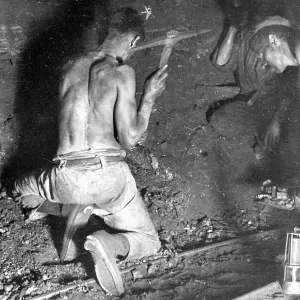 Miners working at the coalface, South Wales