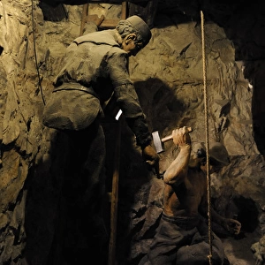 Mining. Shaft sinking by hand with hammer and wedge. Diorama