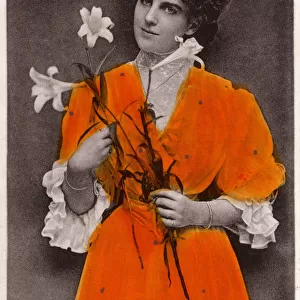 Miss Daisy Cordell holding two Lilies