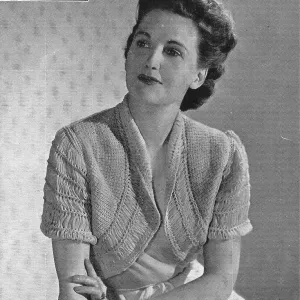 Model wearing a knitted bolero jacket. Date: 1940 Model wearing a knitted bolero jacket. Date: 1940